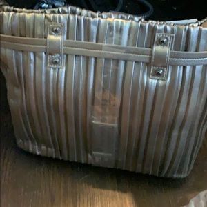 New with tags silver (pewter) colored hobo purse.